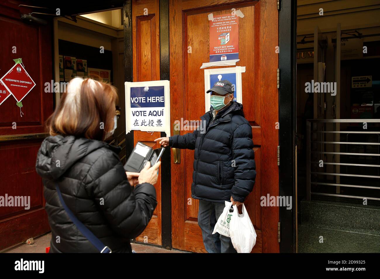 New York City, USA. 03rd Nov, 2020. New York City voters are seen at a Chinatown polling site a section of New York City on November 3, 2020. While there has been a record number of people voting early, voters who prefer to cast their ballots in person will be required to wear protective face masks and keep their social distancing at the polling sites. Most poling sites will be open between 6:00 am and 9:pm throughout the city. ( Photo by John Lamparski/ Credit: Sipa USA/Alamy Live News Stock Photo