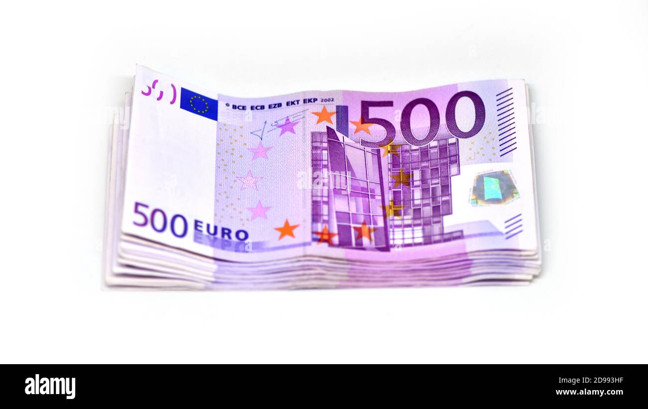Stack of 500 Euro banknotes. European currency money banknotes isolated on white backdrop. Top view closeup. Salary, savings, european union economic Stock Photo