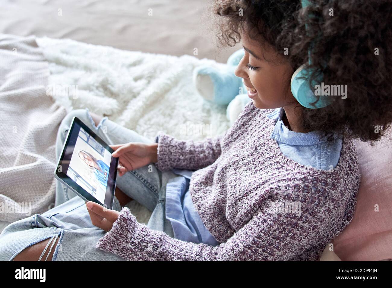 African kid girl talking to grandmother on video conference online call. Stock Photo