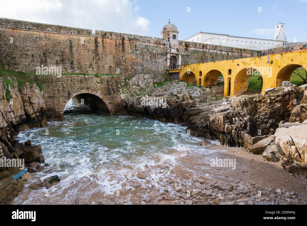 Peniche Fortress with beautiful historic bridge and sea coming from a cave, in Portugal Stock Photo