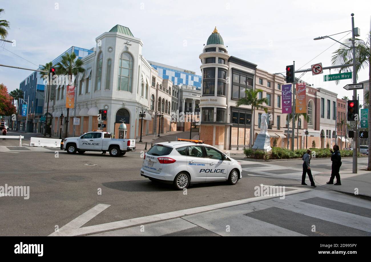 Businesses on Rodeo Drive in Beverly Hills, CA are are boarded up and closed as the street is locked down with a police presence on election day to discourage looting after the election  results are announced. Nov. 3, 2020 Stock Photo