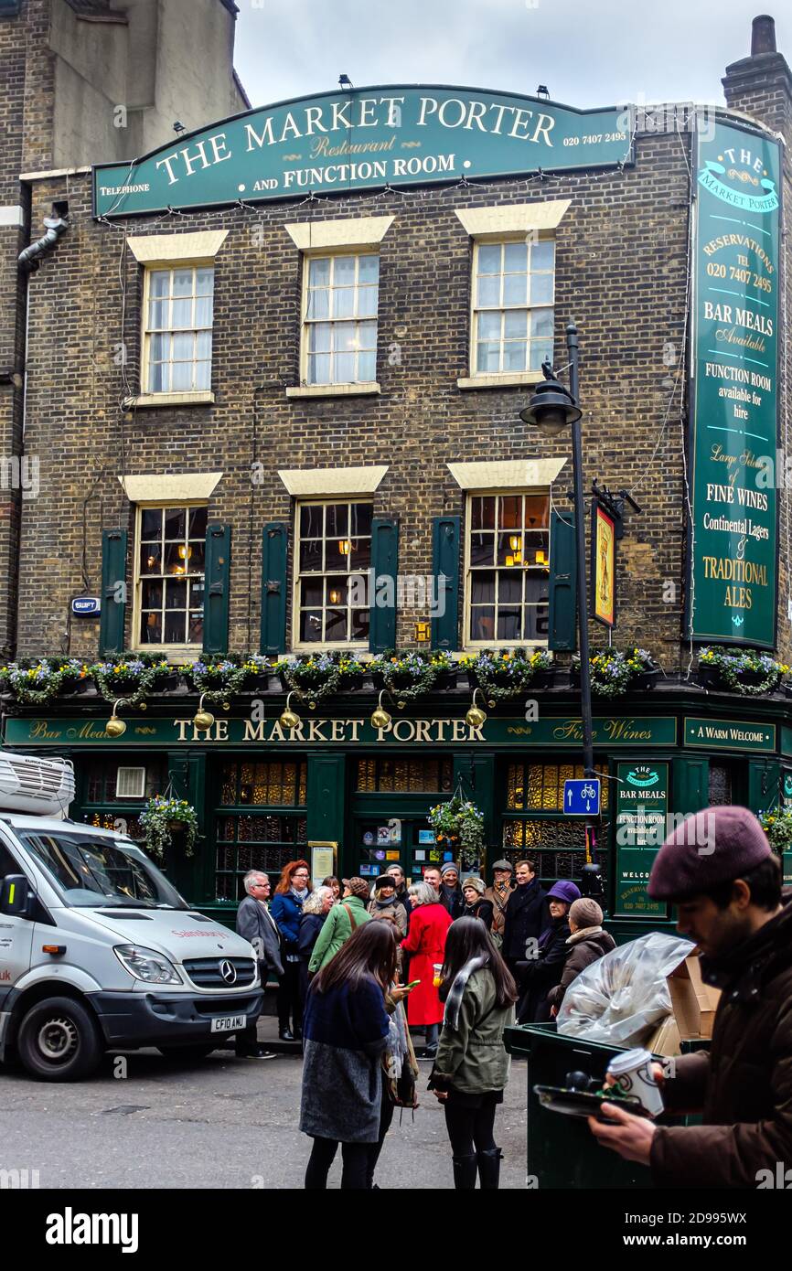 London, UK, December 7, 2013: passersby in front of 'The Market Porter', Borough Market Stock Photo