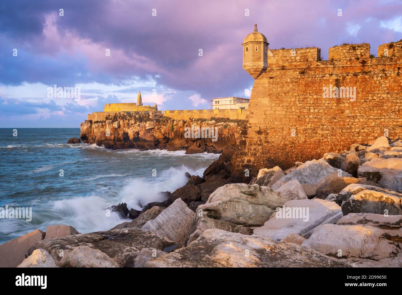 peniche-fortress-at-sunset-with-beautiful-golden-light-with-sea-waves
