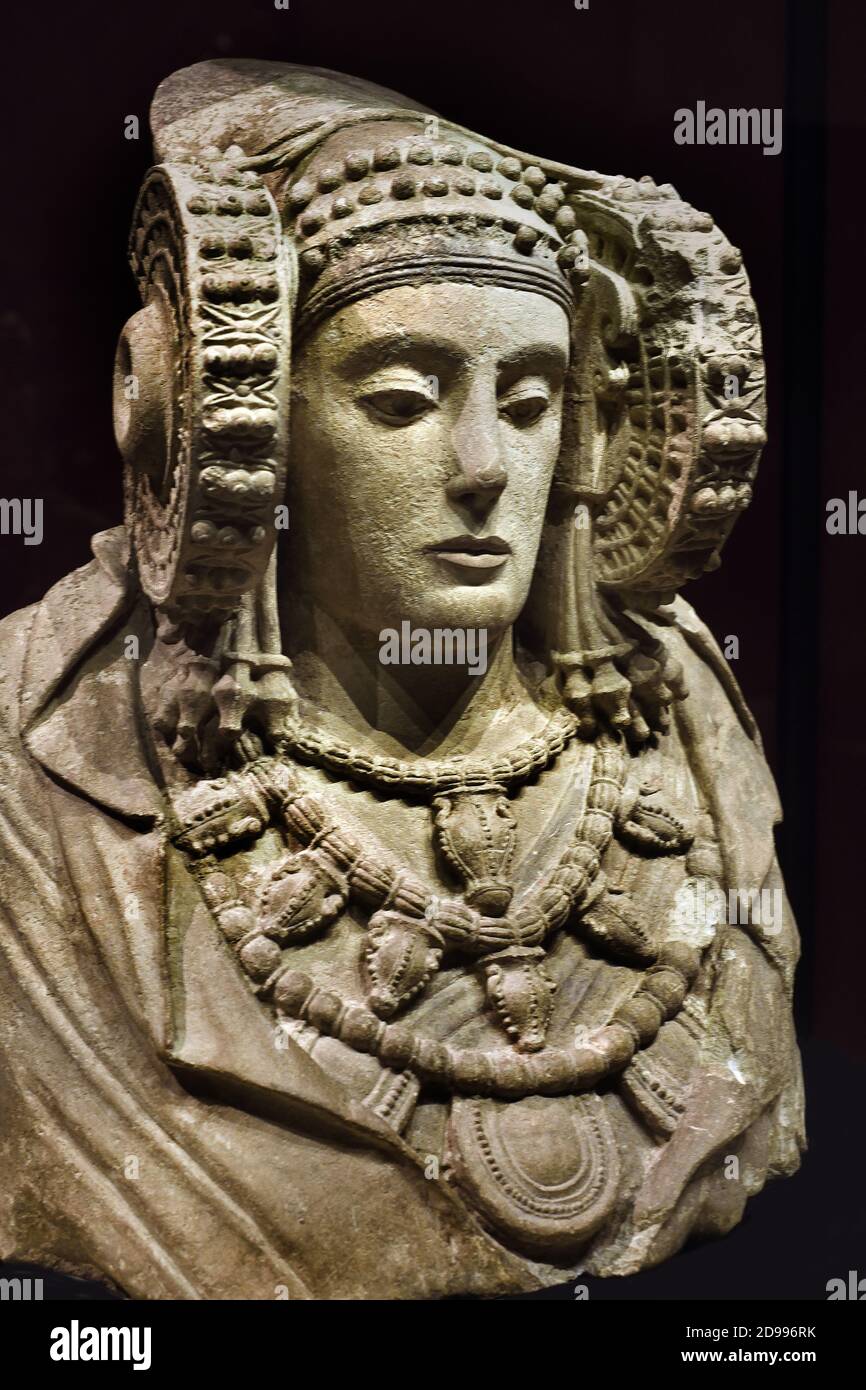 The Lady of Elche (Dama d'Elx in Valencian; Dama de Elche in Spanish) is a limestone bust sculpture of a woman, dated to the 5th or 4th century BC, discovered on August 4, 1897 on an ancient Roman site in Alcudia,  Spain, Spanish National Archaeological Museum of Spain Stock Photo