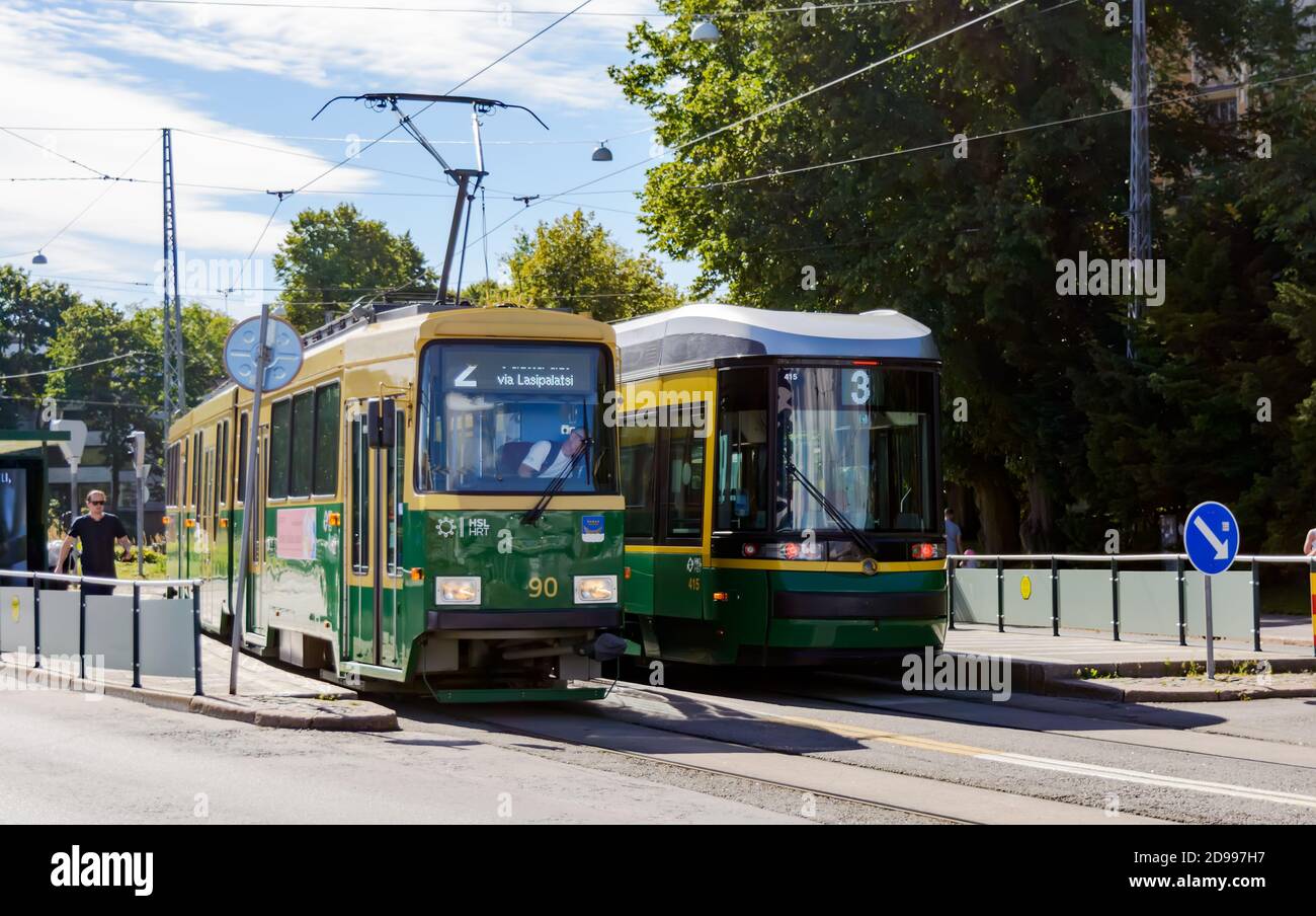 Two generations of trams - Valmet and Artic in the center of Helsinki Stock Photo