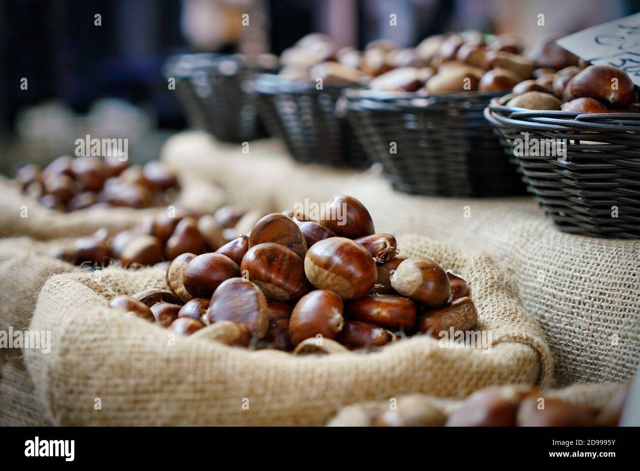 Top view heap of chestnuts. Pile of ripe chestnuts for food background Stock Photo