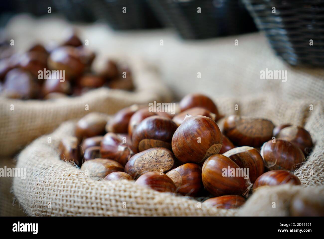 Top view heap of chestnuts. Pile of ripe chestnuts for food background Stock Photo