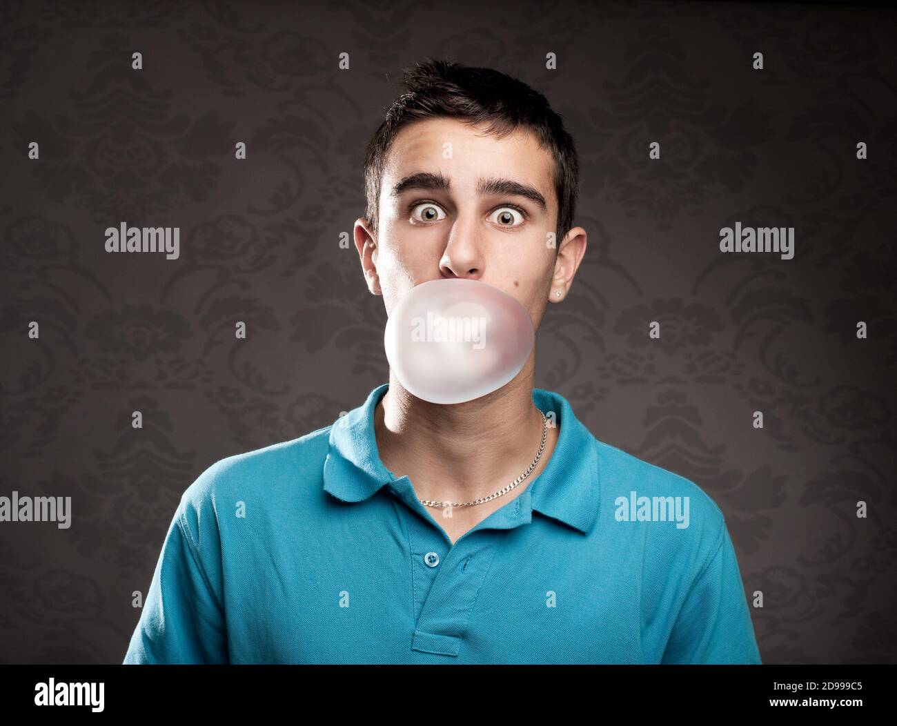 boy making a bubble from a chewing gum Stock Photo Alamy