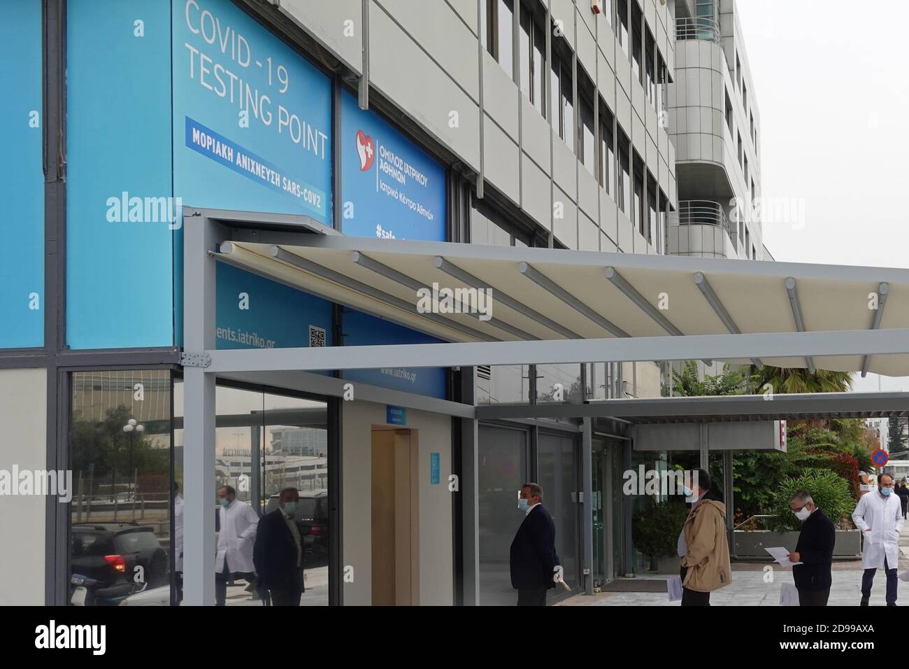 Athens, Greece - November 3, 2020: People waiting in line at covid-19 coronavirus testing point. Molecular detection of sars-cov-2 virus. Stock Photo