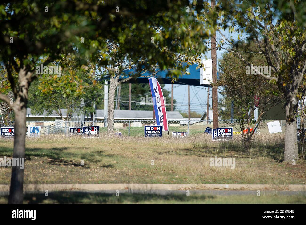 Austin, Texas, USA. 3rd Nov, 2020. November 03, 2020: Election Day signs with Biden and Harris line up outside of the George Morales Dove Springs Recreation Center. Austin, Texas. Mario Cantu/CSM Stock Photo