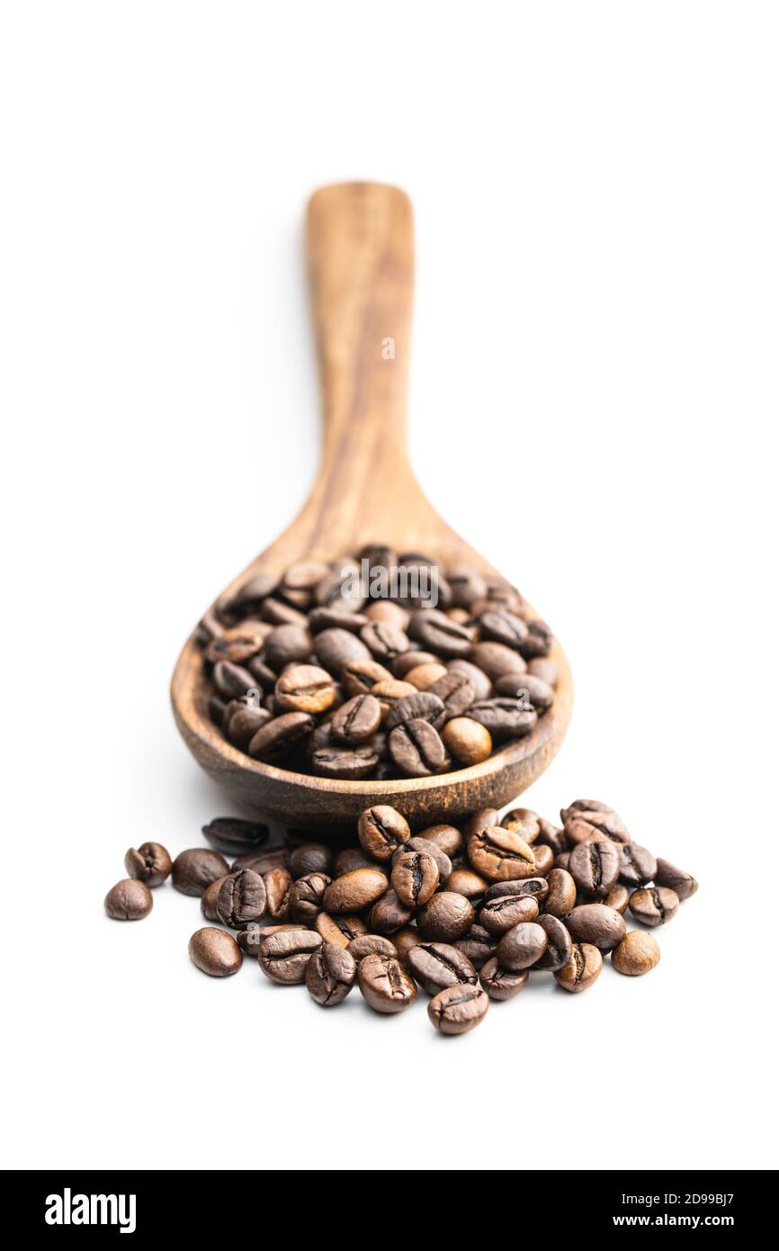 Roasted coffee beans on wooden spoon isolated on white background Stock ...