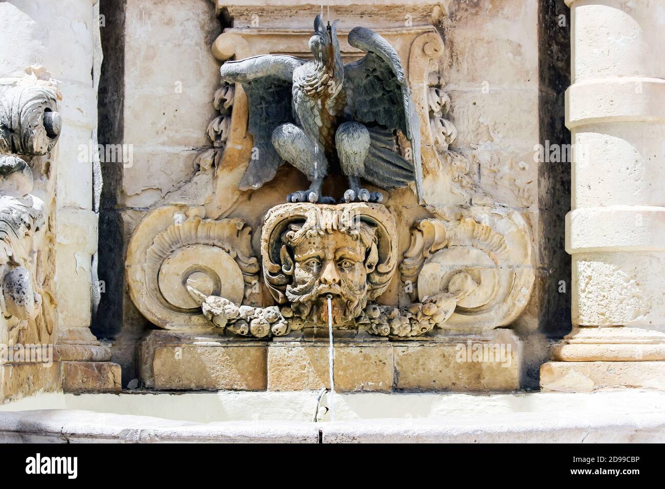 stone face sculpture water fountain in Malta Stock Photo Alamy