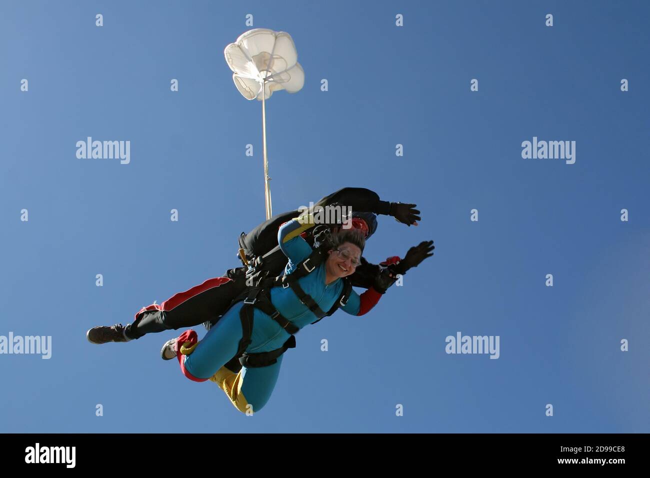 Skydive tandem jumping ou the plane Stock Photo