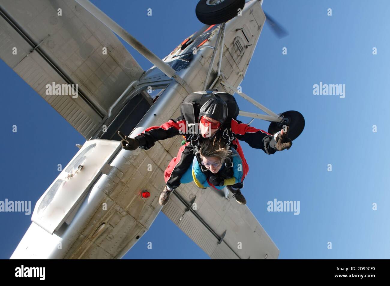 Skydive tandem jumping ou the plane Stock Photo