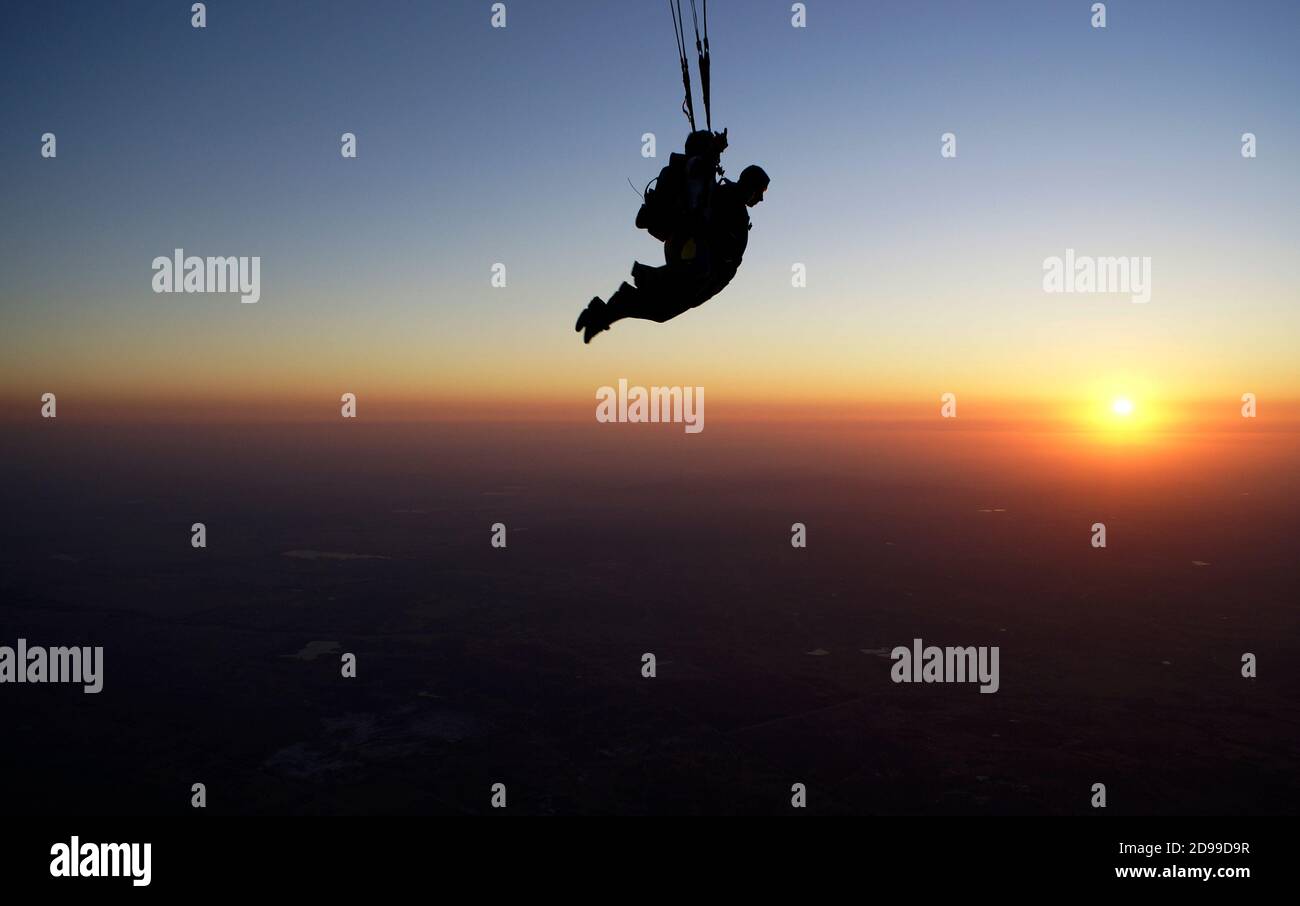 Skydiving tandem at the awesome sunset Stock Photo