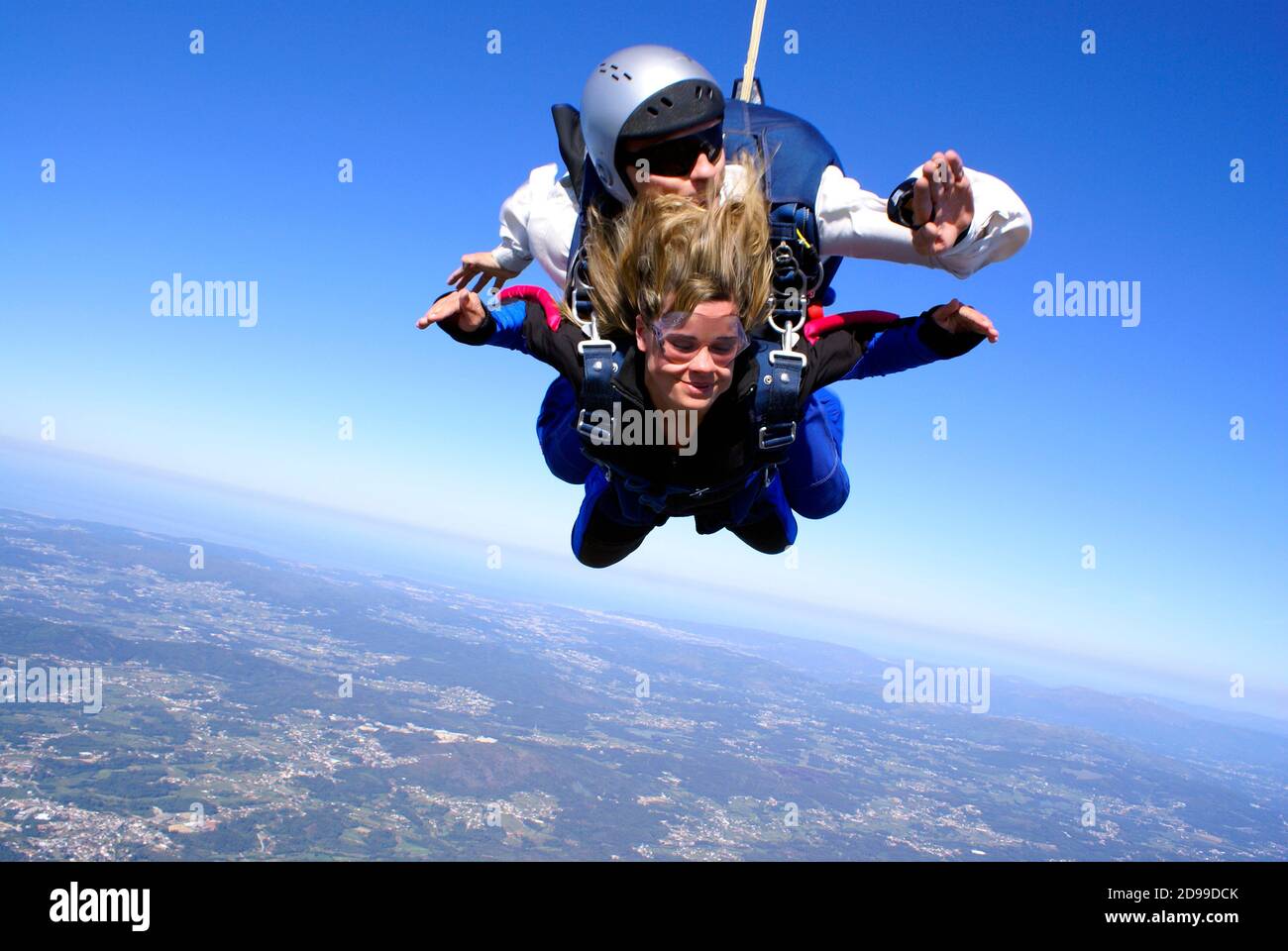 Sky diving tandem woman hair style Stock Photo