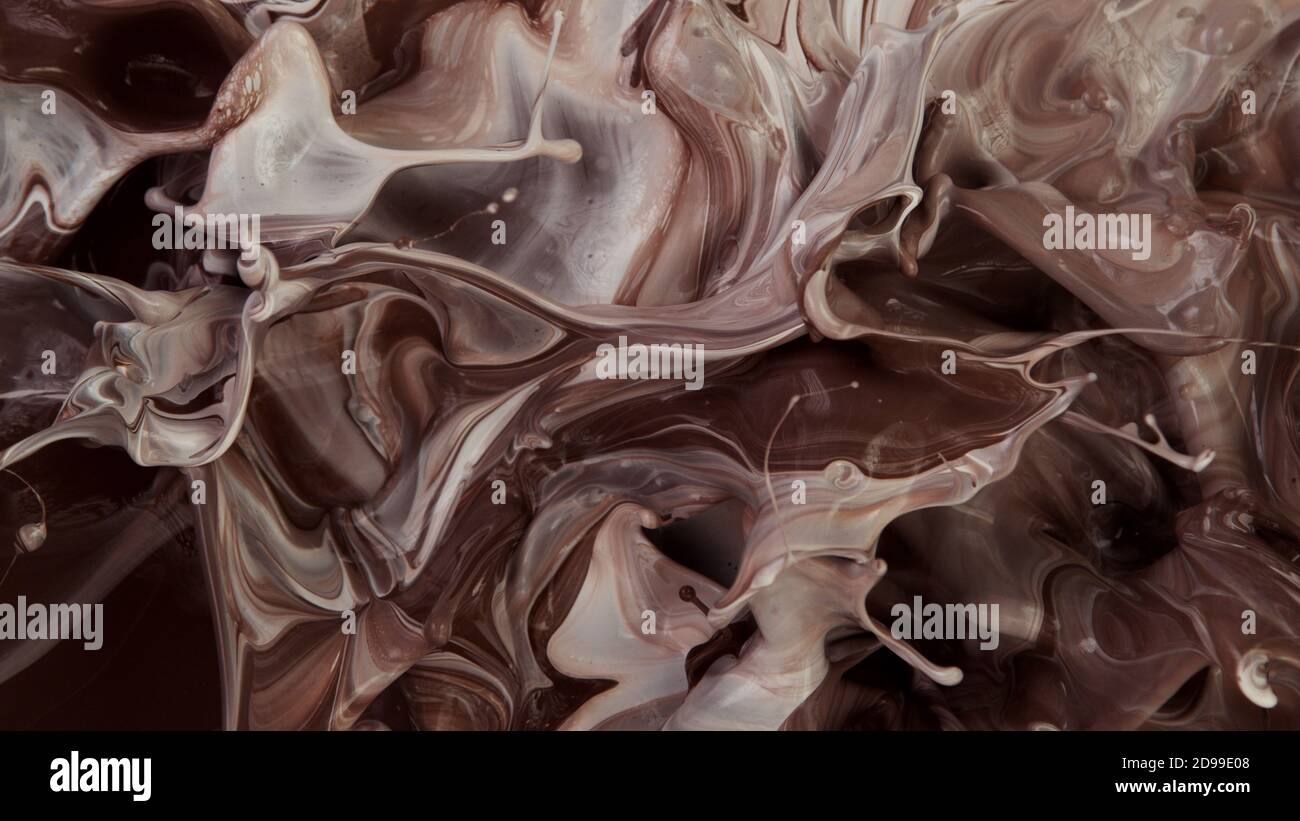 Closeup of splashing hot chocolate with milk, freeze motion Stock Photo