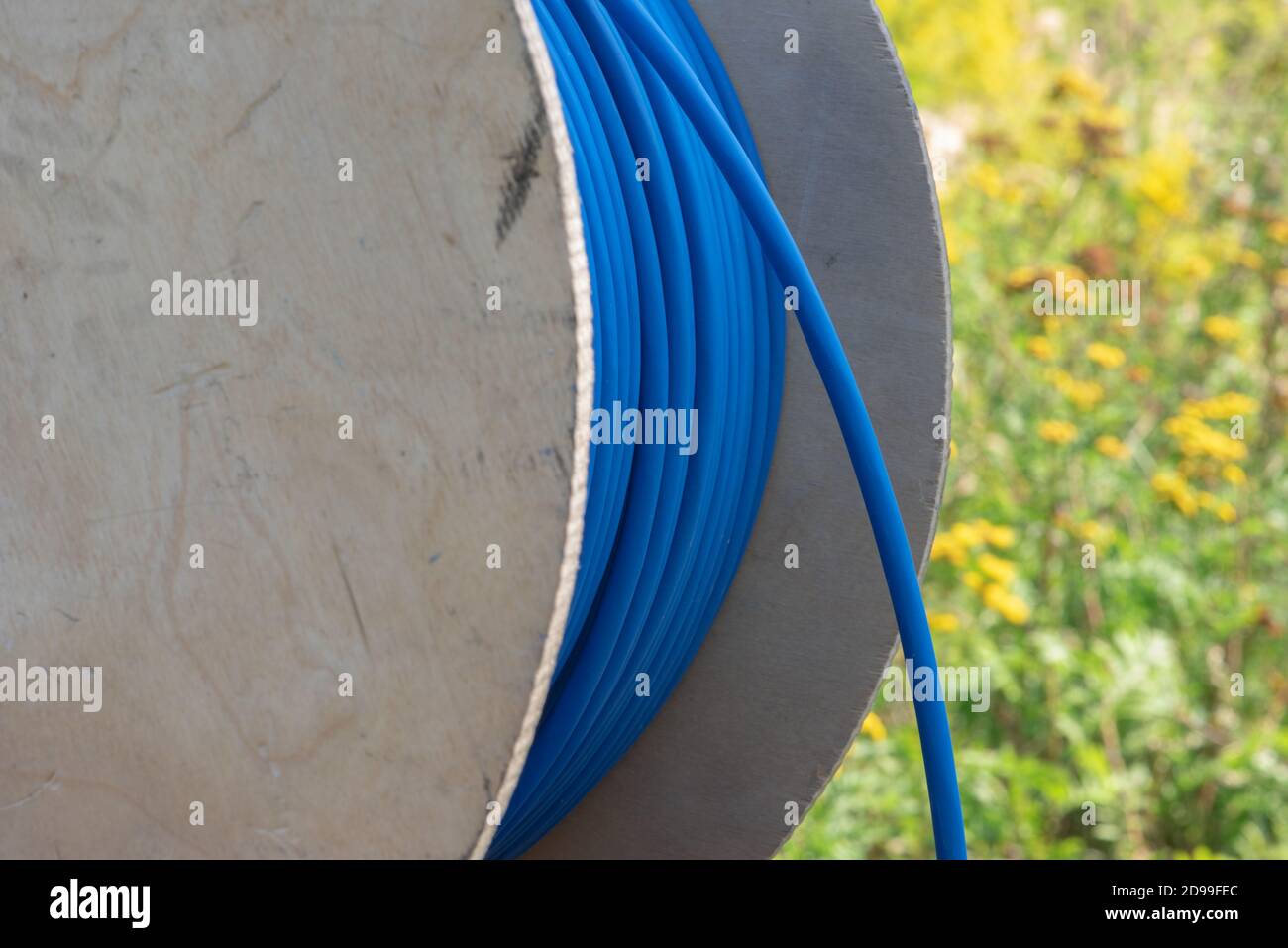 Cable drum with blue network cord closeup Stock Photo