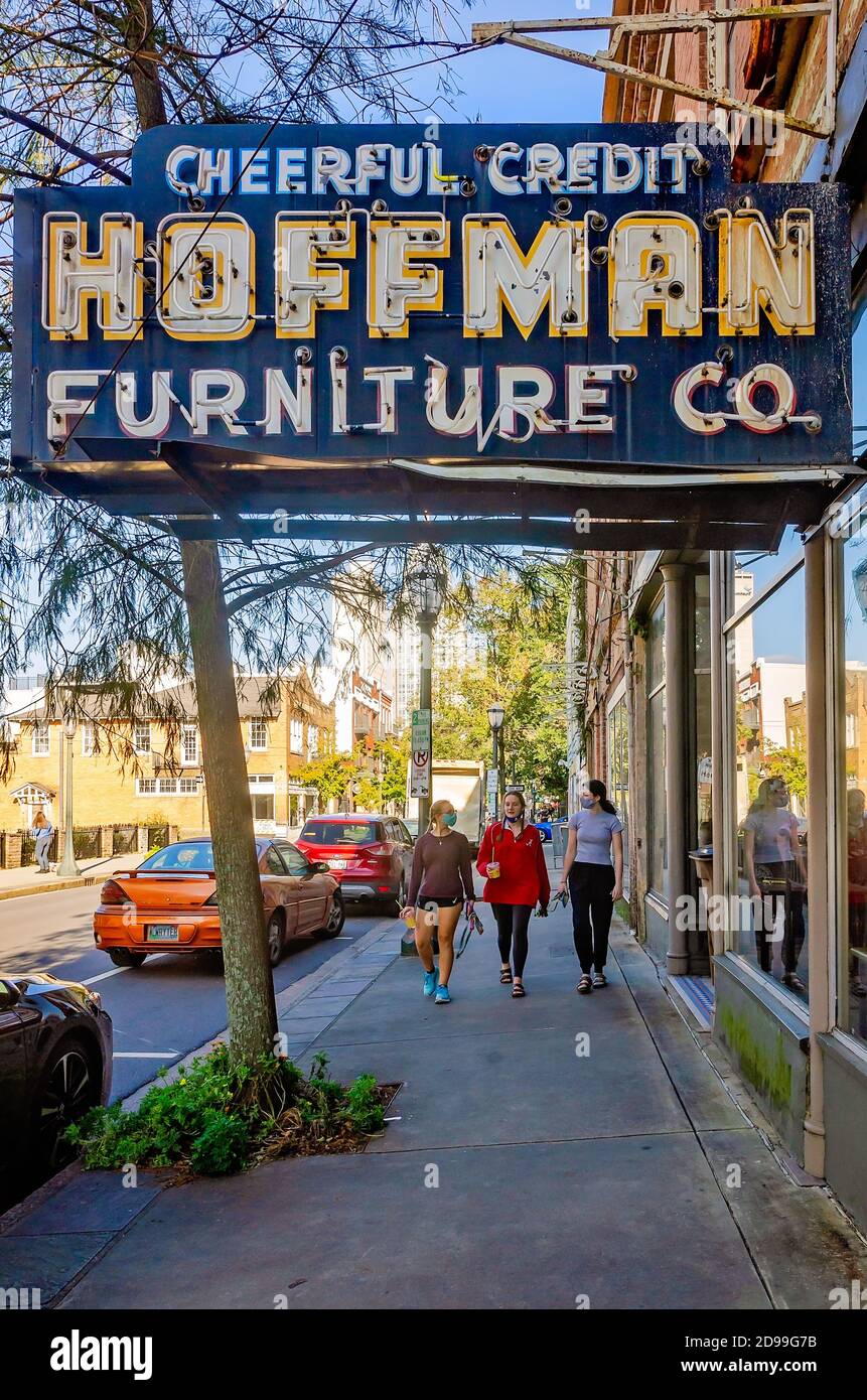 A vintage neon sign advertises cheerful credit at Hoffman Furniture Co., Oct. 31, 2020, in Mobile, Alabama. The store is located on Dauphin Street. Stock Photo