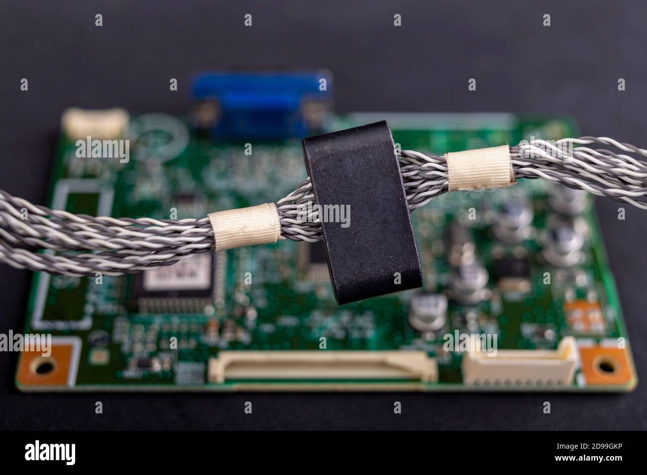 on several electric wires. Ferrite filter to protect the electrical device. Dark