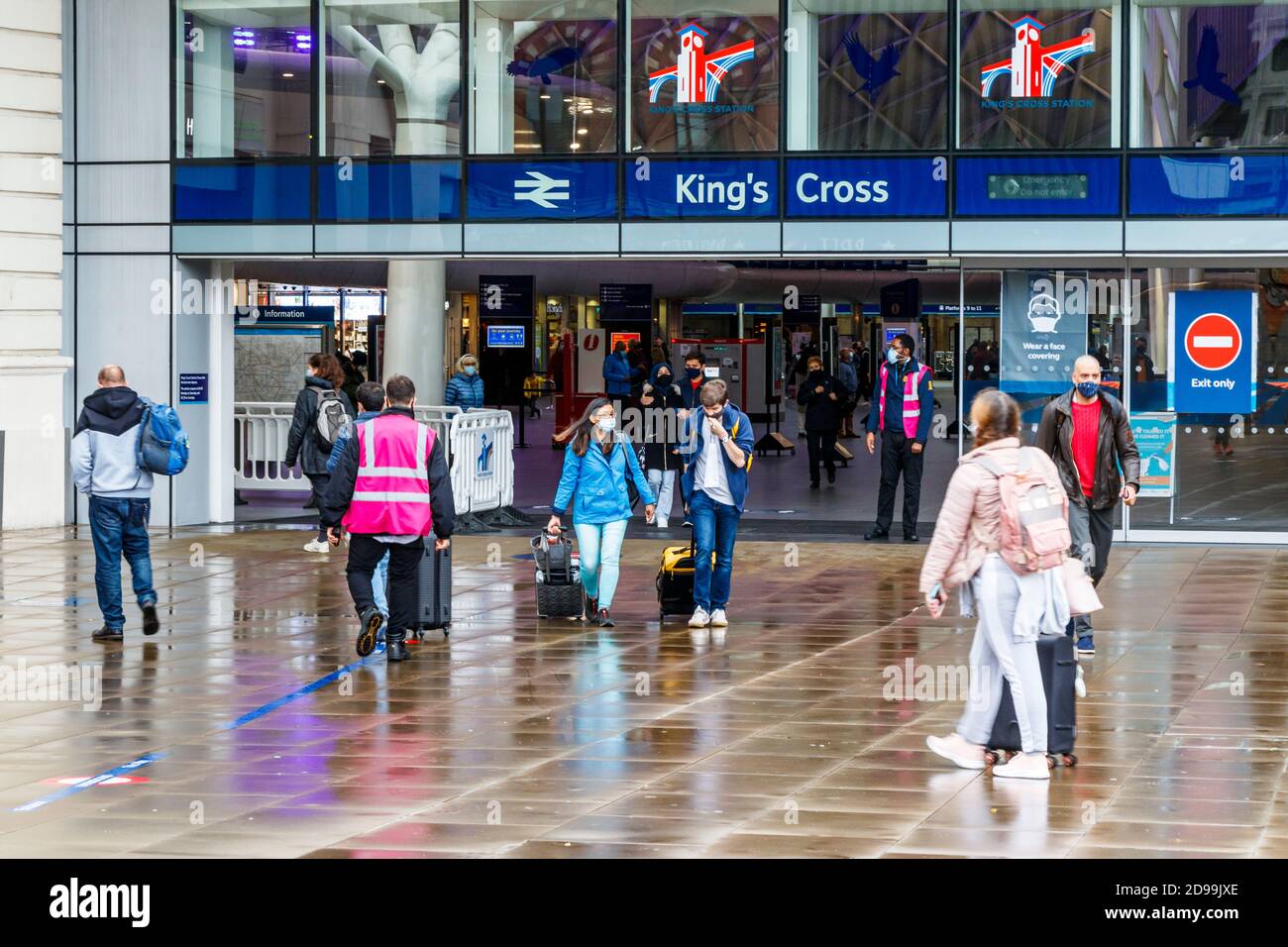 Travellers exiting King's Cross station on a wet October afternoon, London, UK Stock Photo