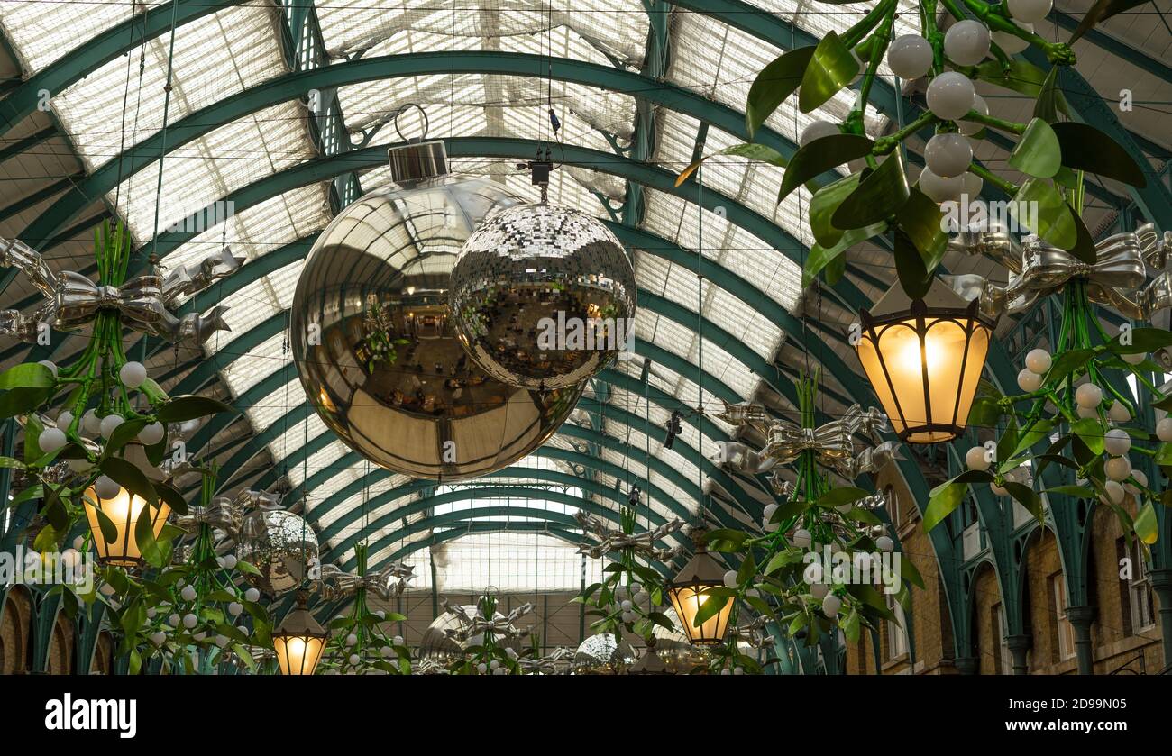 Covent Garden Market Christmas decorations with hanging silver balls and mistletoe. London Stock Photo