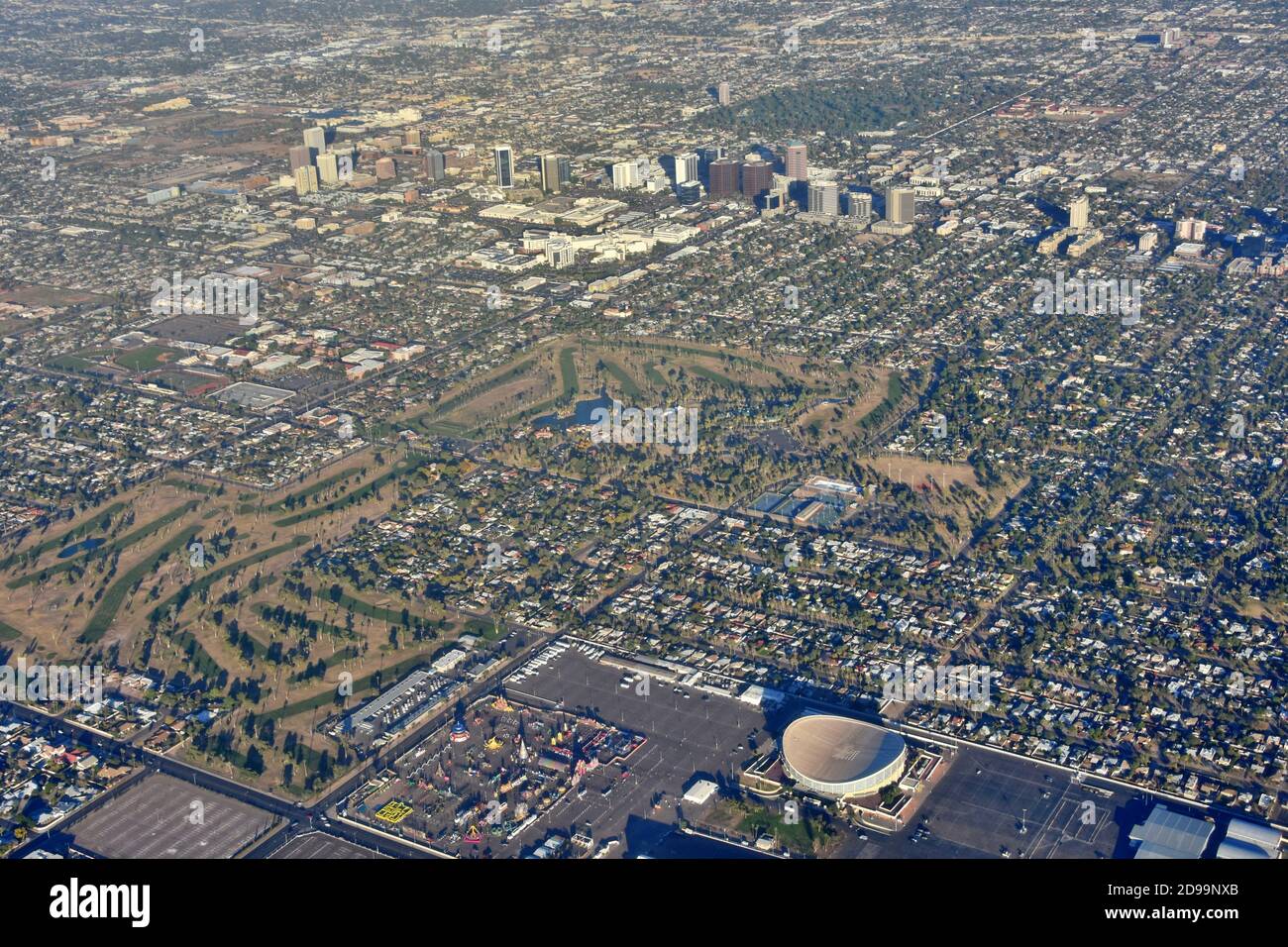 Aerial landscape view of Phoenix, Arizona with Arizona Veterans Memorial Coliseum, golf course, amusement park and city skyline in the view. Stock Photo