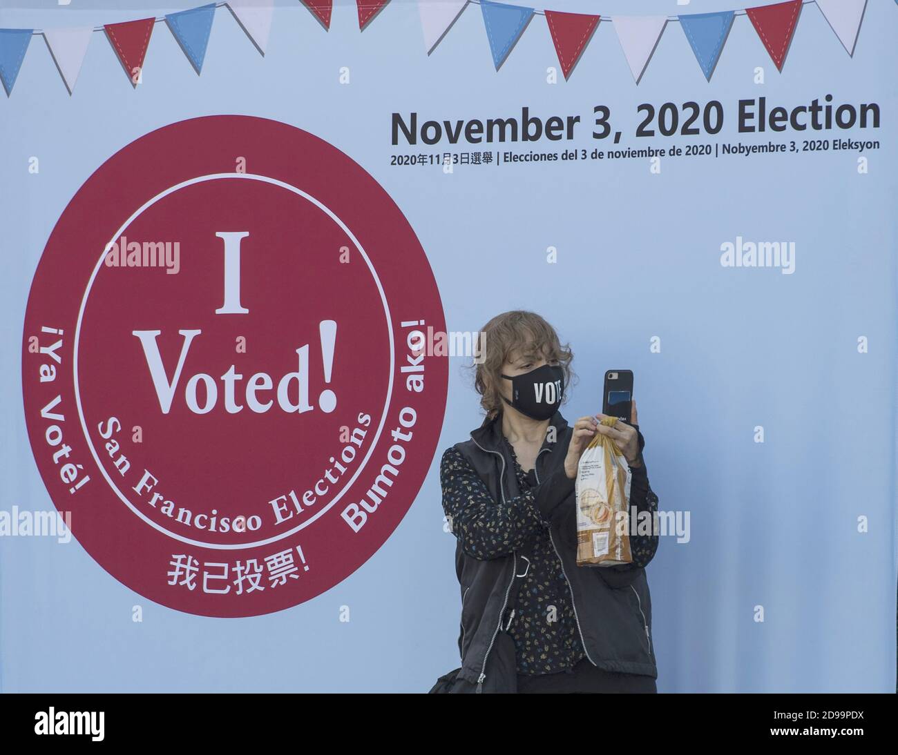 San Francisco, United States. 03rd Nov, 2020. A voter takes a selfie at the polling palce and ballot dropoff in the Civic Center of San Francisco on election day, Tuesday, November 3, 2020. Photo by Terry Schmitt/UPI Credit: UPI/Alamy Live News Stock Photo