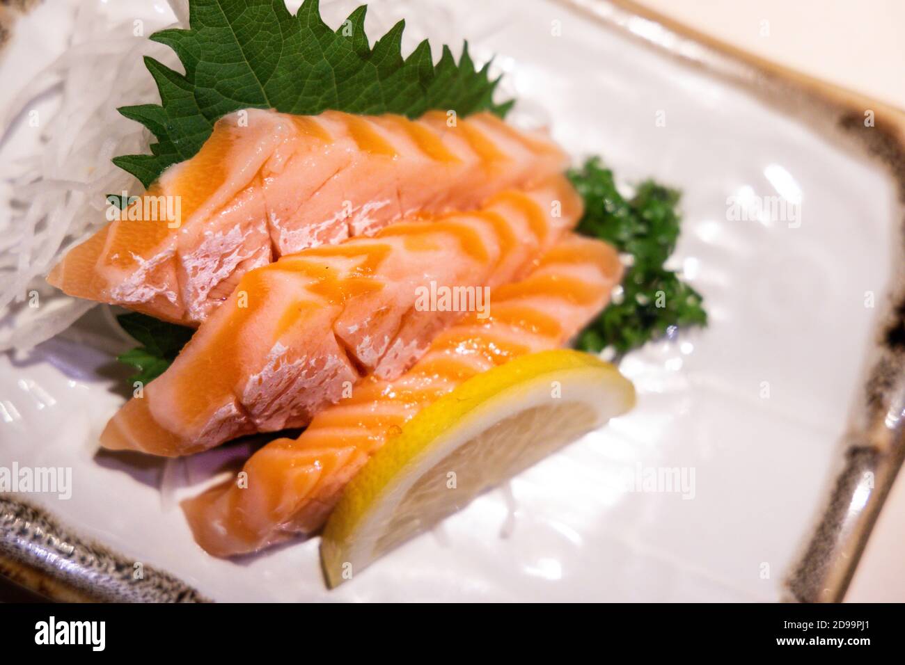 Fresh salmon belly sashimi served on plated in Japanese restaurant Stock Photo Alamy