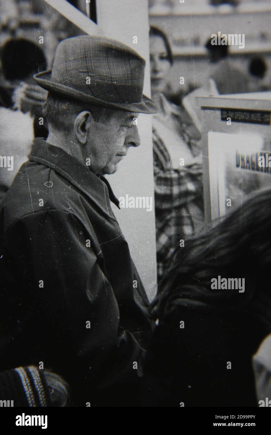 Fine 1970s Vintage Black And White Photography Of A Young Man Smoking A Cigarette And Having A Friendly Conversation Image383980878