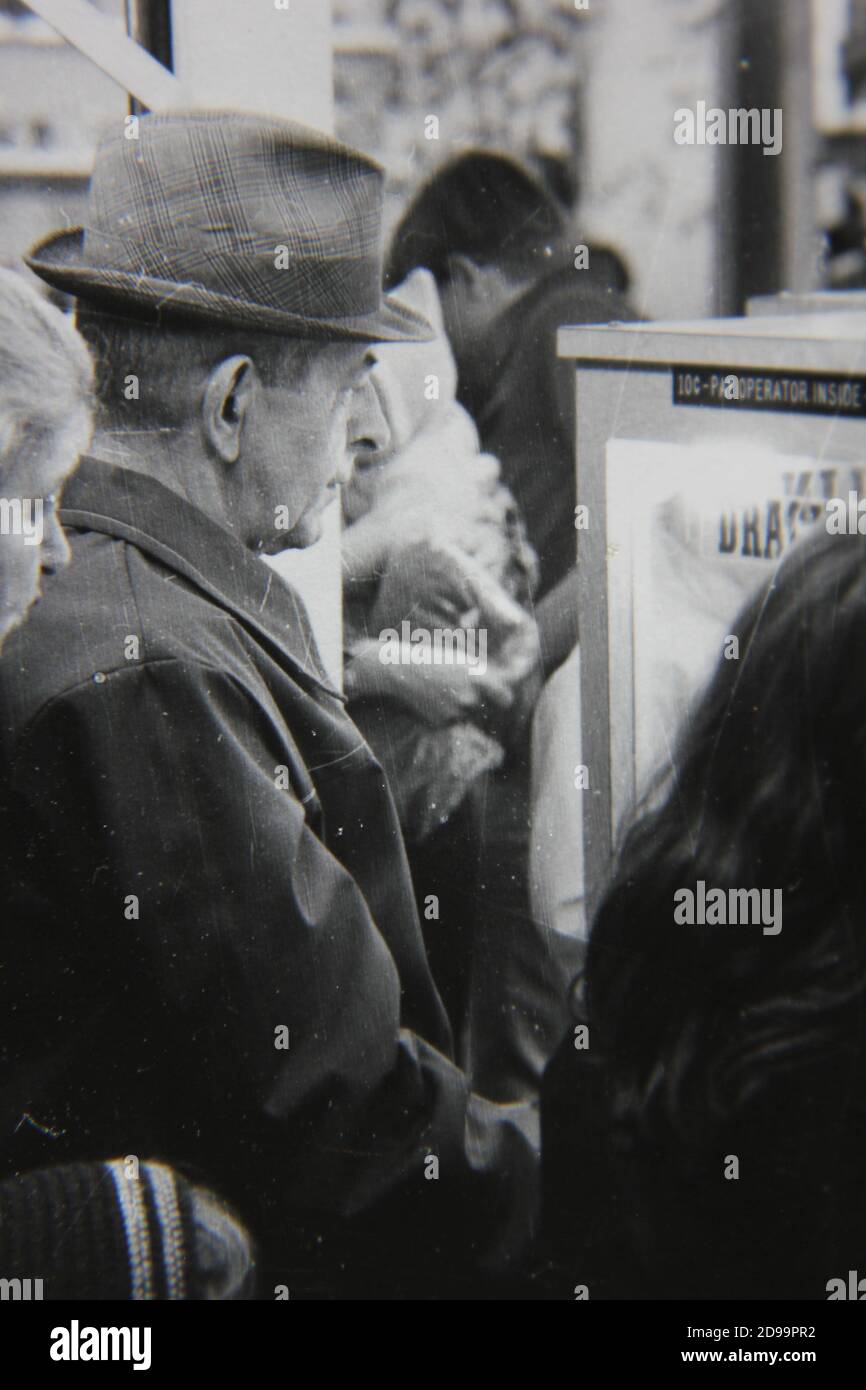 Fine 1970s Vintage Black And White Photography Of A Young Man Smoking A Cigarette And Having A Friendly Conversation Image383980878
