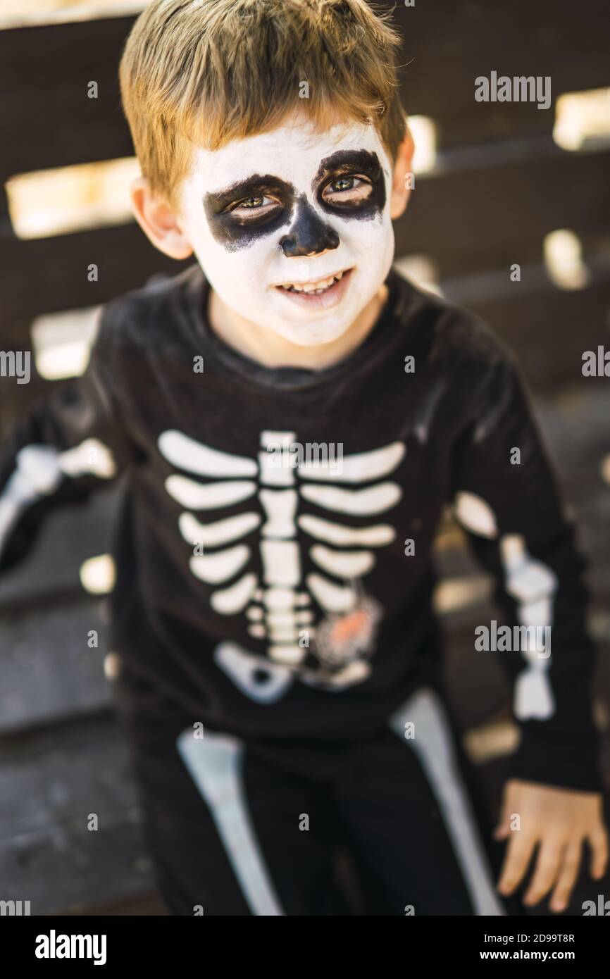 Cute little boy wearing a Halloween skeleton costume Stock Photo Alamy