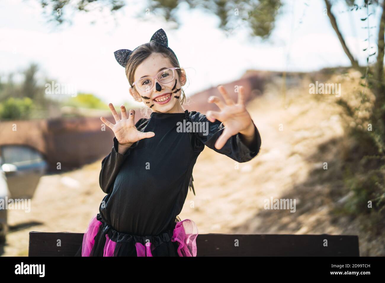 Portrait of a cute little girl wearing a Halloween cat costume Stock ...