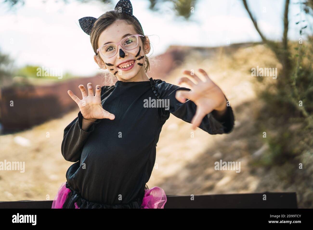 Portrait of a cute little girl wearing a Halloween cat costume Stock ...