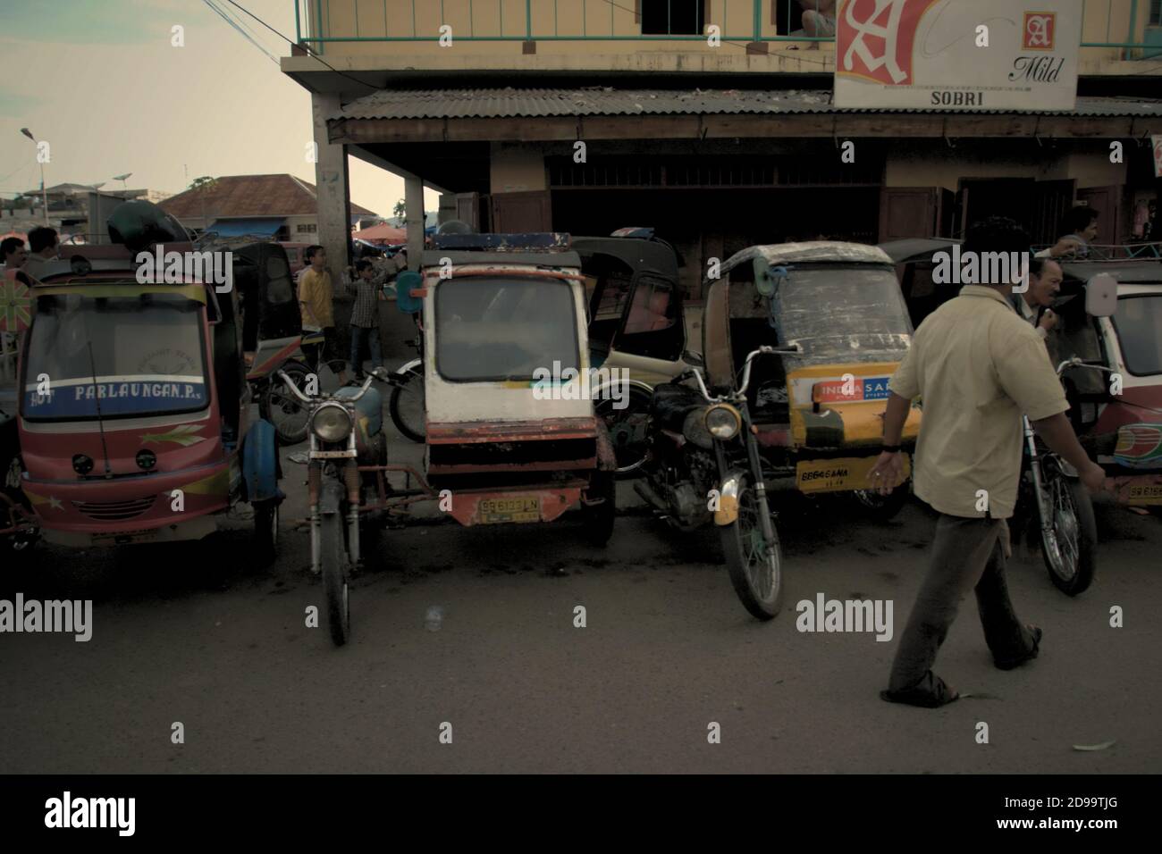 A line of auto rickshaws in Sibolga City, North Sumatra province ...