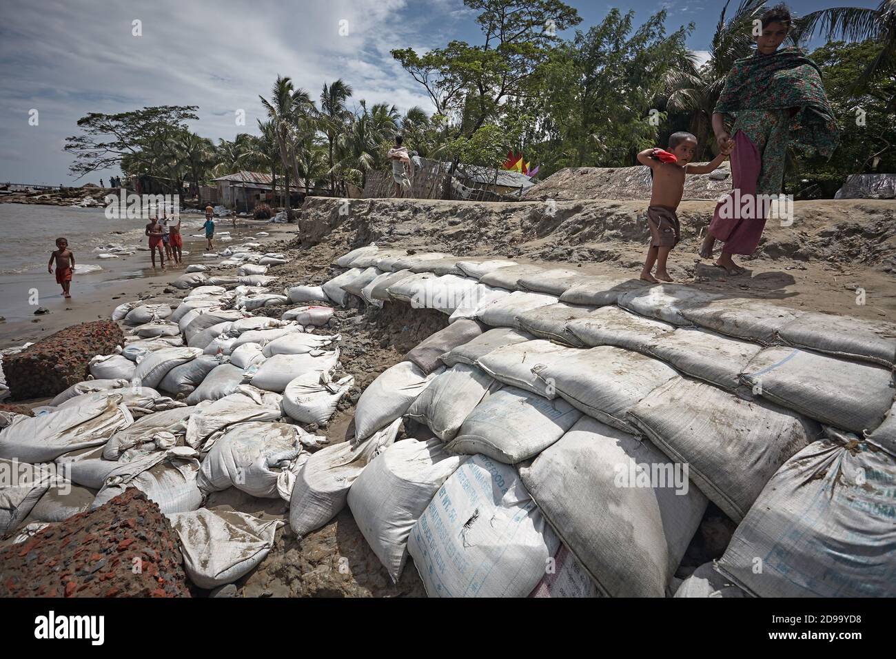 Kutubdia, Bangladesh, July 2009 - Sandbags on the seashore to protect houses from rising sea levels due to climate change. Stock Photo
