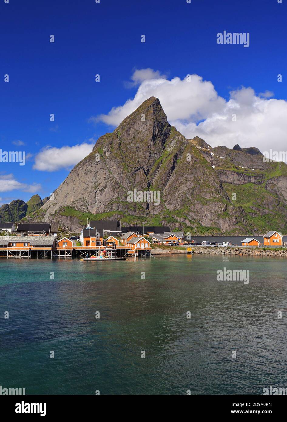 Sakrisøy Island with colorful yellow fishing houses in a sunny day, Lofoten, Norway Stock Photo