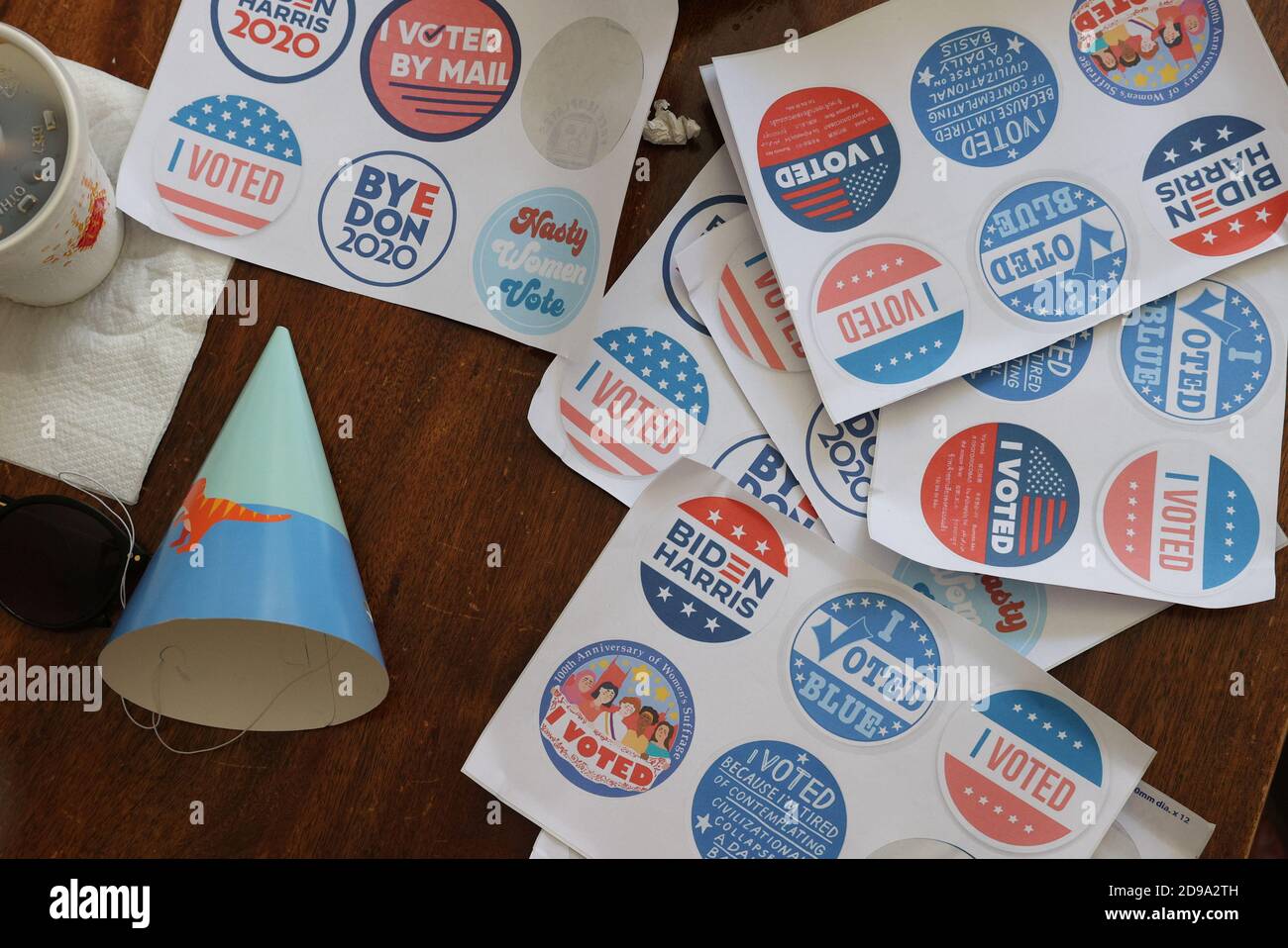 Stickers are seen on a table at a home watch party as U.S. citizens living abroad watch results come in for the U.S. presidential election between President Donald Trump and Democratic presidential nominee Joe Biden in Sydney, Australia, November 4, 2020.  REUTERS/Loren Elliott Stock Photo