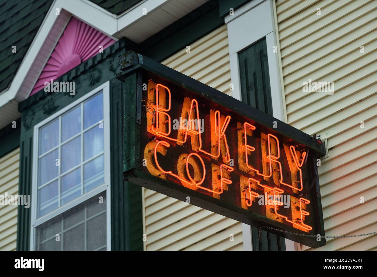 Mackinaw City, Michigan, USA. A local bakery that caters to visitors during the tourist season sports an old-fashioned neon sign above its entrance. Stock Photo