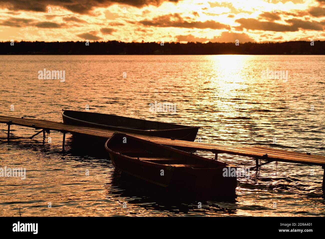 Trout Lake, Michigan, USA. A few remaining clouds mute the late