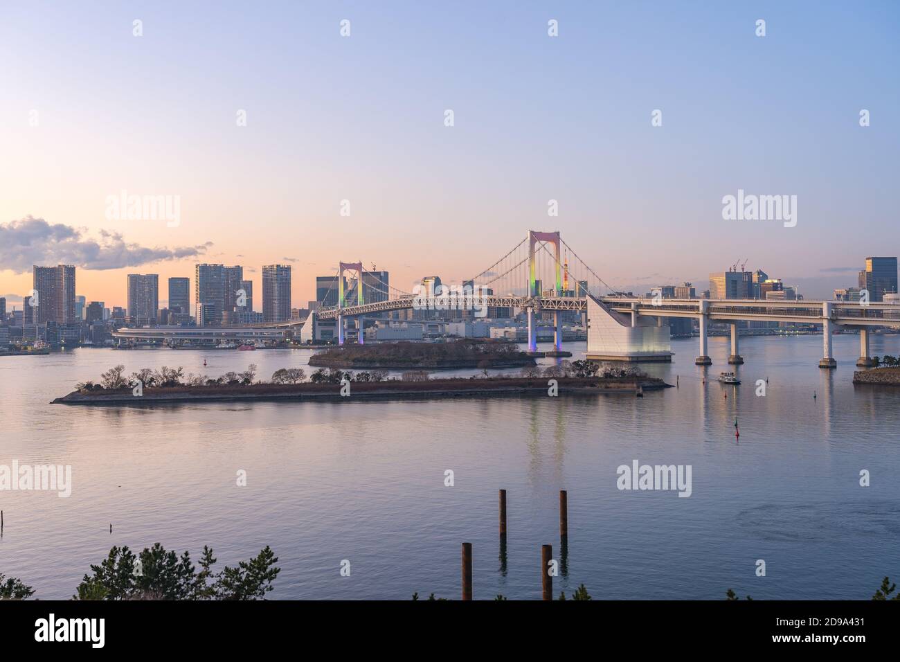 Tokyo bay at twilight with view of Rainbow Bridge in Tokyo city, Japan. Stock Photo