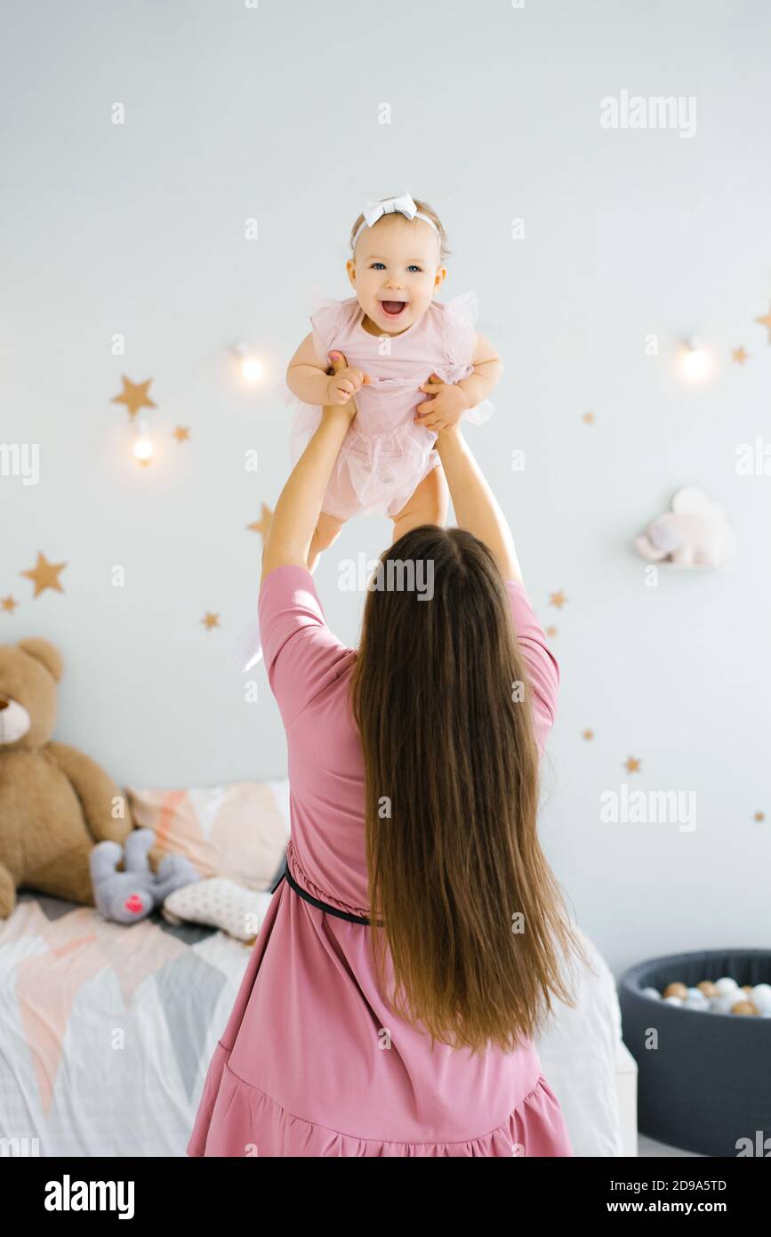 Infant playing mother hair hires stock photography and images Alamy