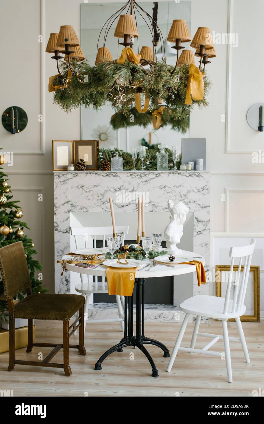 Stylish Scandinavian interior of the dining room with a Christmas ...