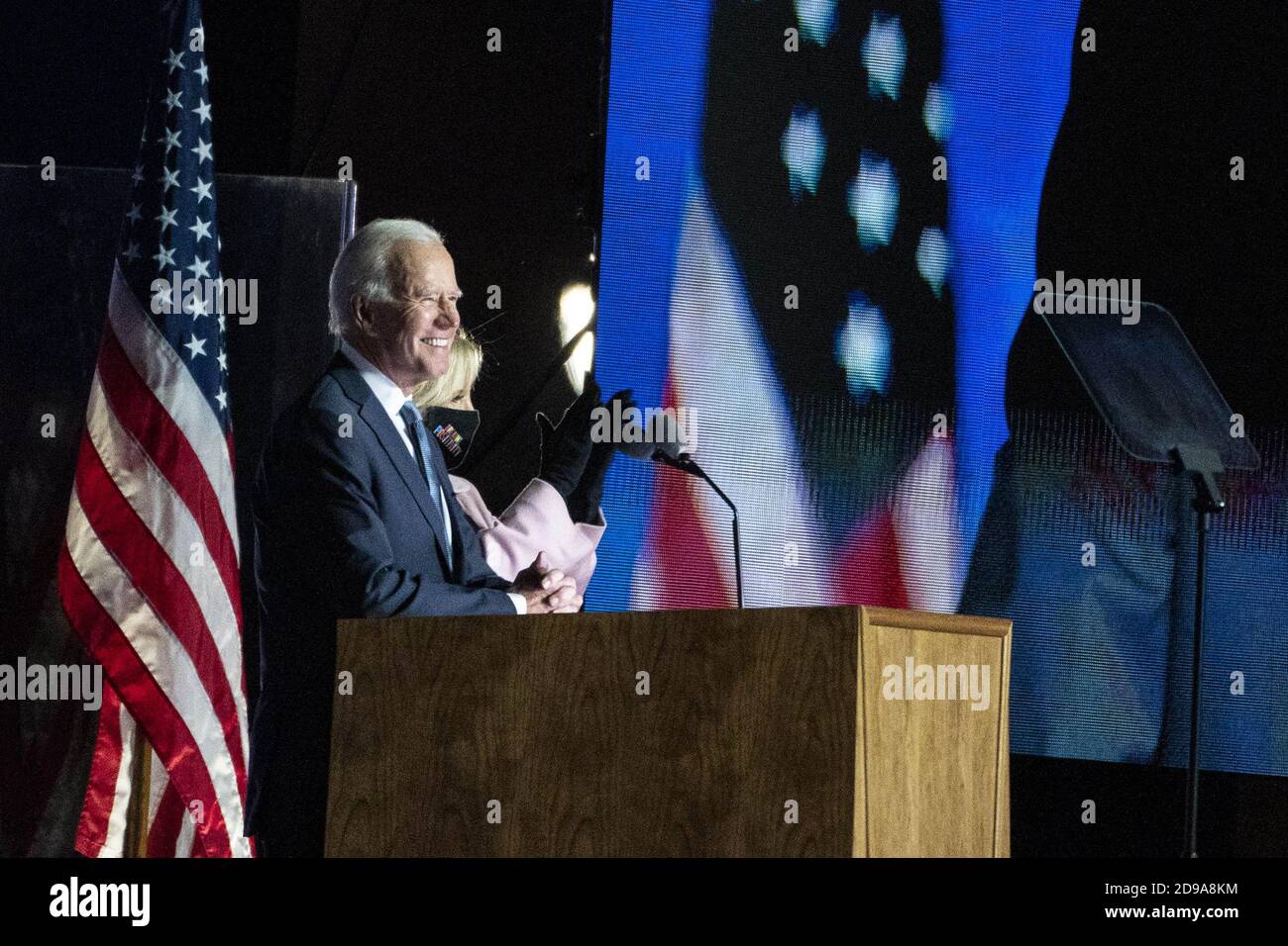 Wilmington, United States. 04th Nov, 2020. Joe Biden, 2020 Democratic presidential nominee, speaks as wife Jill Biden, right, listens during an election night party in Wilmington, Delaware on Wednesday, November 4, 2020. President Donald Trump has once again defied polls and predictions, with a strong showing across the Sun Belt in early results appearing to significantly shrink Biden's path to victory. Pool photo by Sarah Silbiger/UPI Credit: UPI/Alamy Live News Stock Photo