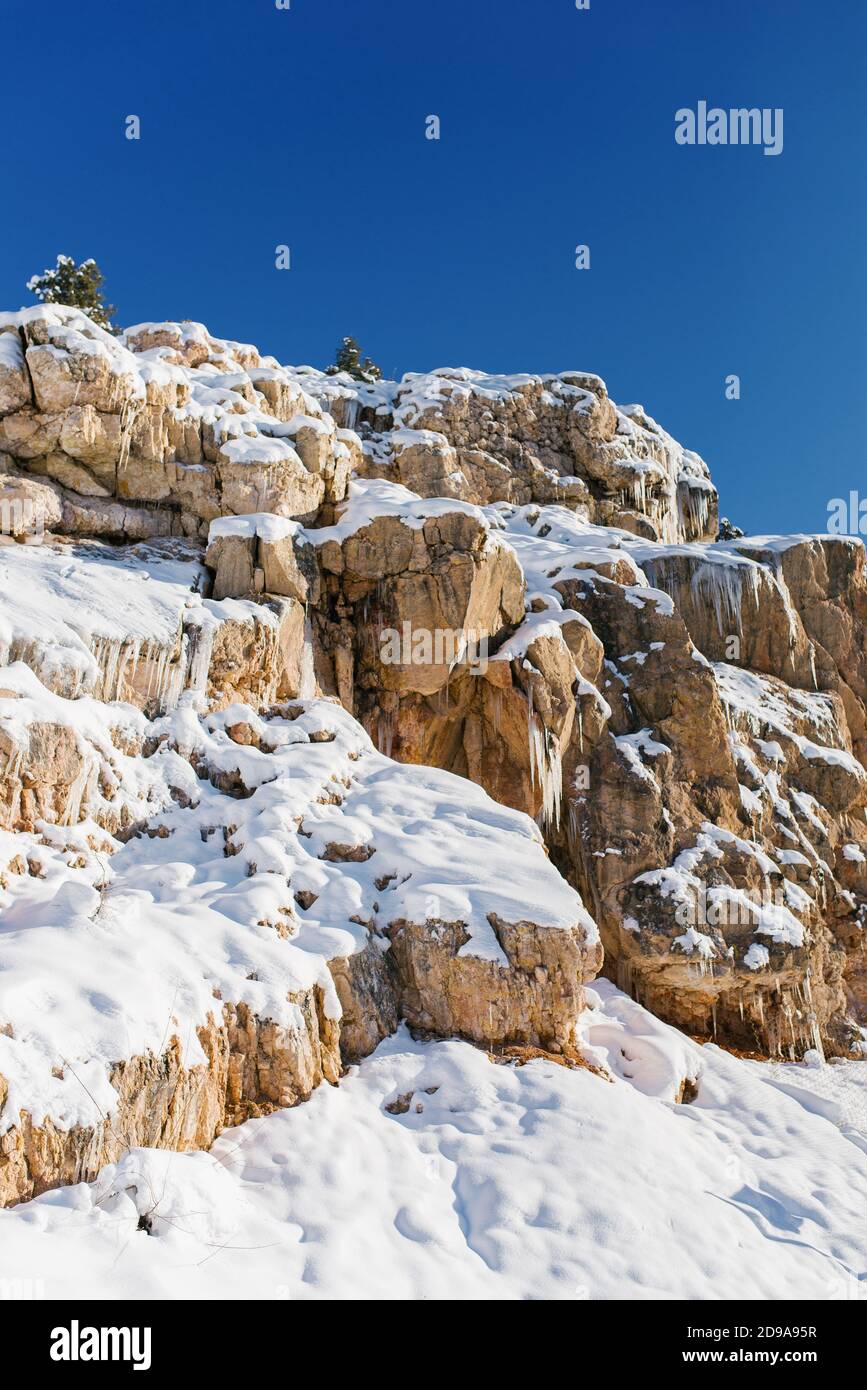 Beautiful rock mountains covered with snow in winter in Uzbekistan in the area of Beldersay resort Stock Photo