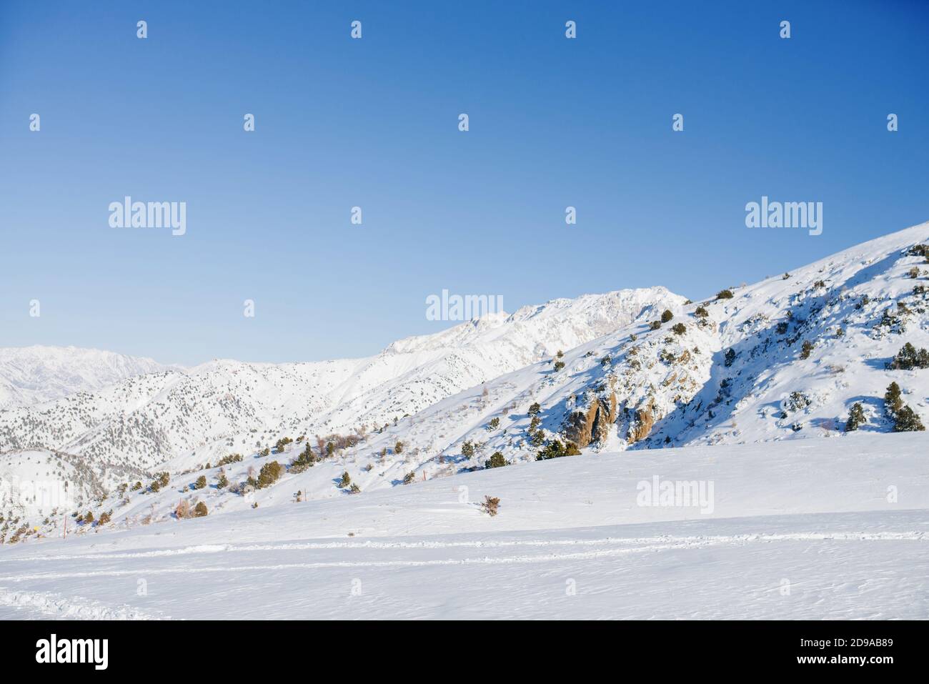 The incredible beauty of the winter landscape of the Tien Shan mountains in Uzbekistan on a clear day Stock Photo