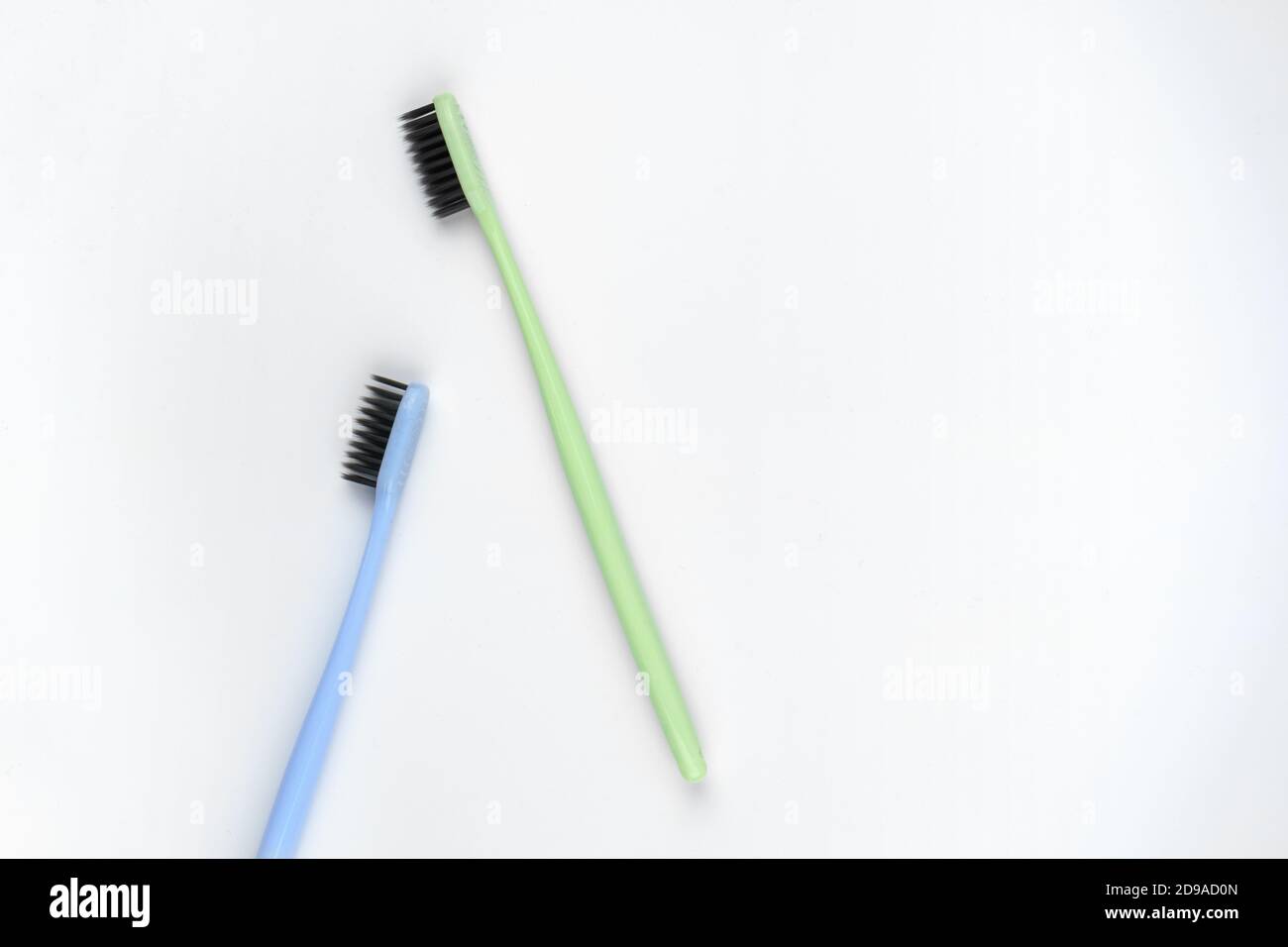 Image of green and blue toothbrushes on isolated white background Stock ...