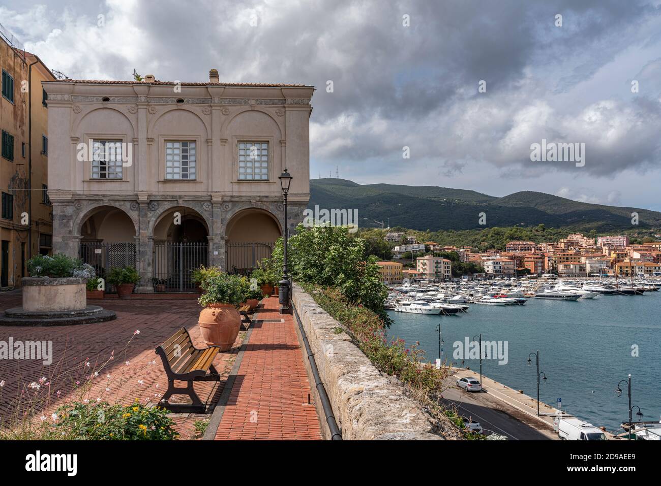 The Governor's Palace, in the background the tourist port of Porto Ercole. Porto Ercole, Grosseto,  tuscany, Italy, Europe Stock Photo
