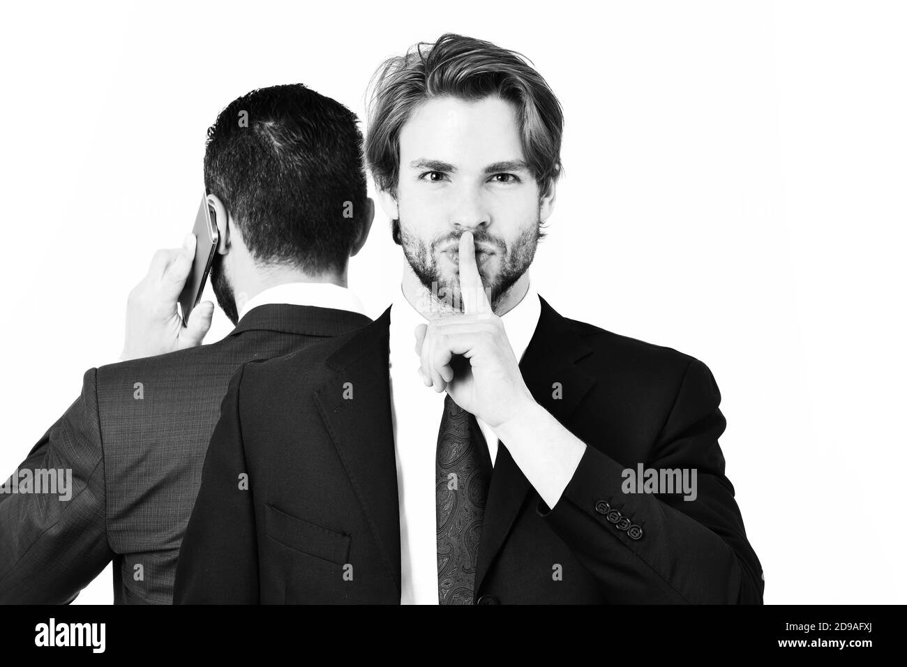 hush gesture, diversion and sabotage, corruption, man with hush gesture