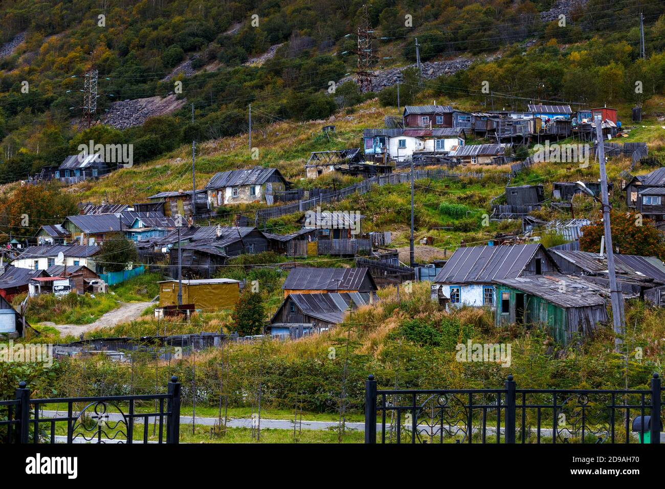 Old wooden houses in the center of Magadan. Russian wooden huts in the
